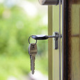 Keys and lock the door on the background of solar garden