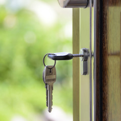 Keys and lock the door on the background of solar garden