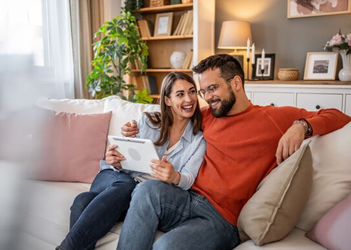 Happy couple looking at house opportunities