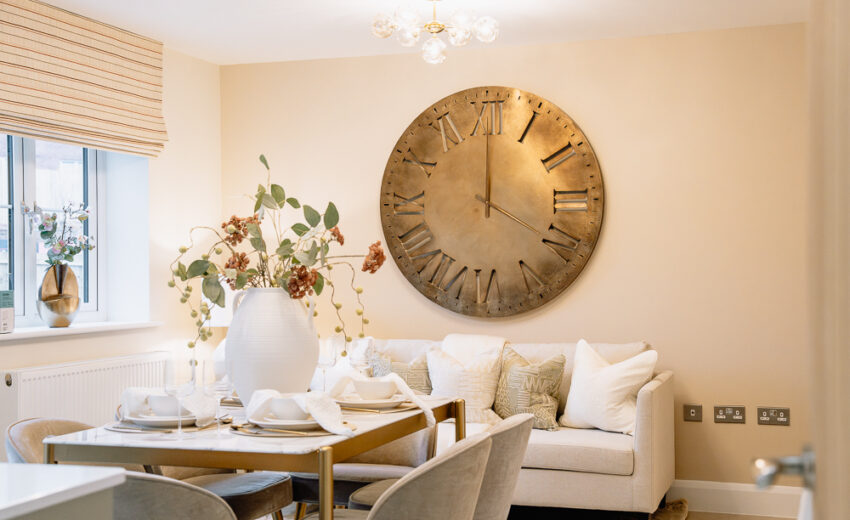 New build dining area with wall art and table setting.