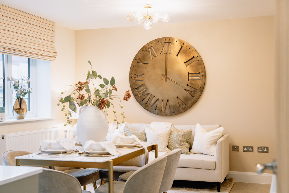 New build dining area with wall art and table setting.