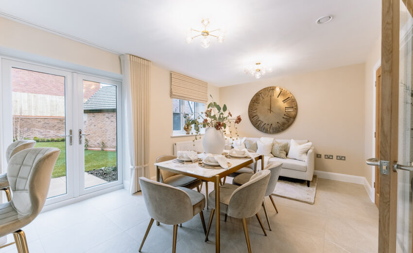 New build dining area with table and large wall art.