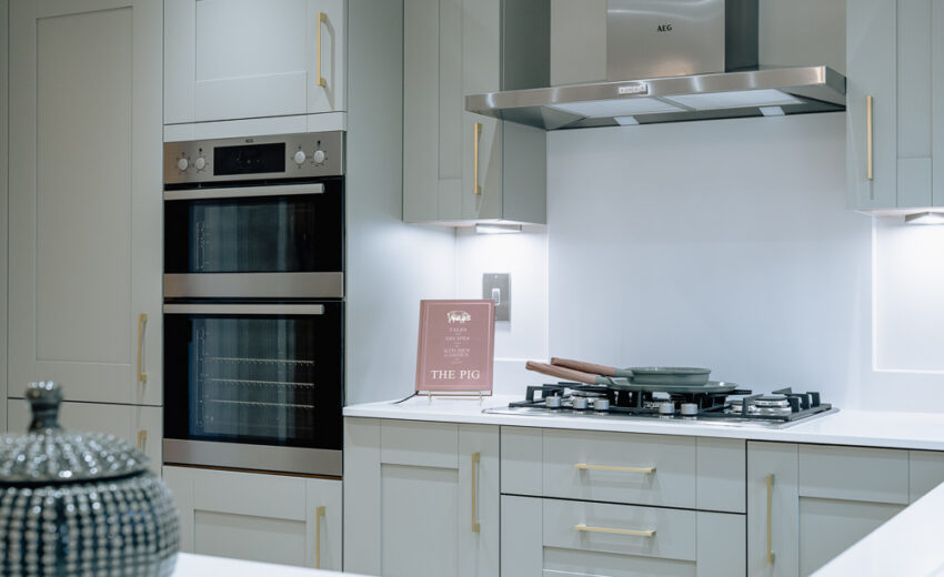 New build kitchen with built-in oven and integrated appliances.