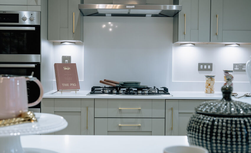 New build kitchen with gas hob and splashback.