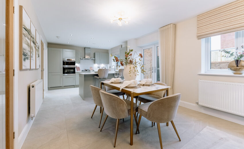 Open-plan dining area with table and chairs.