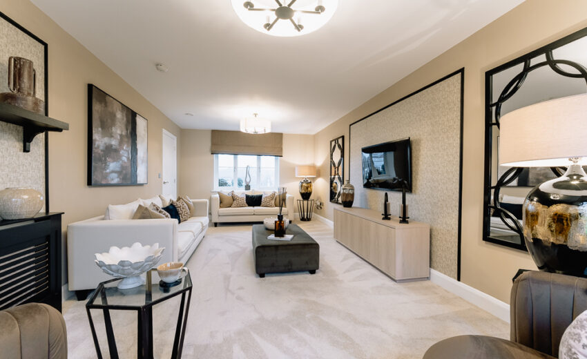New build open-plan living room with media unit and coffee table.
