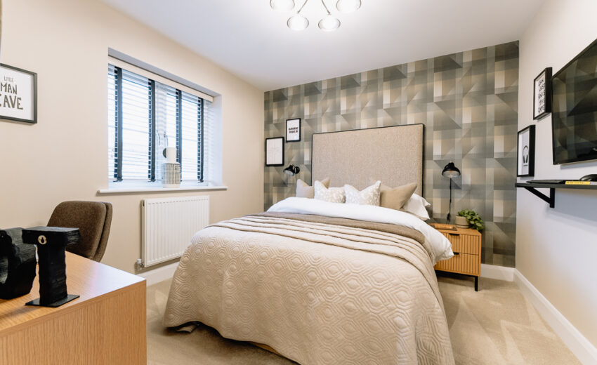 Double bedroom with large windows in the Stretford new build.