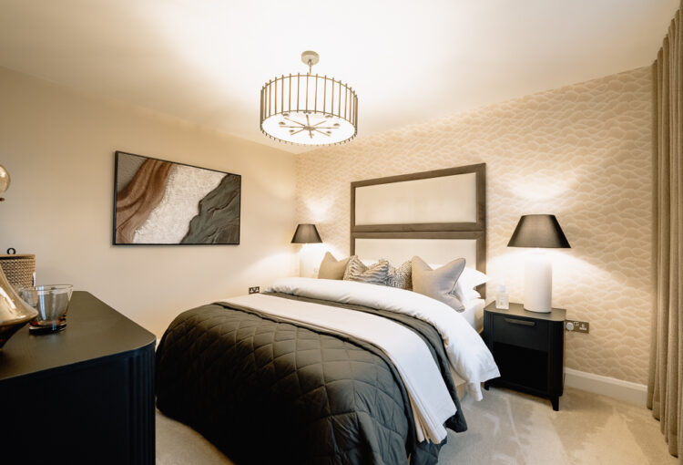 New build bedroom with neutral bedding and pendant light.
