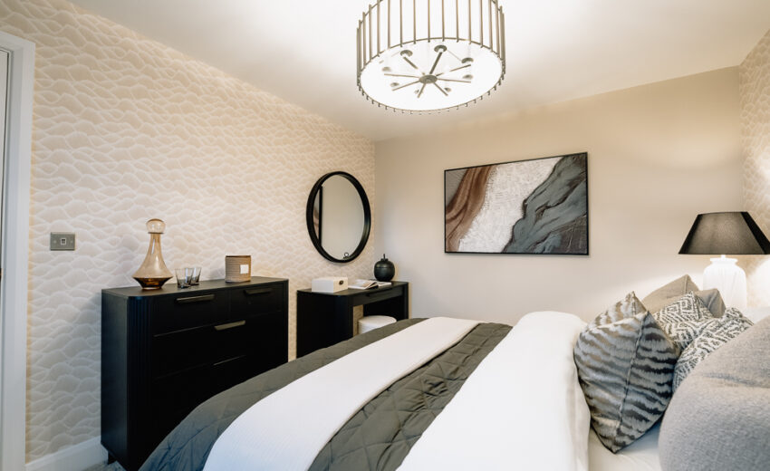New build bedroom with dressing table and pendant light.