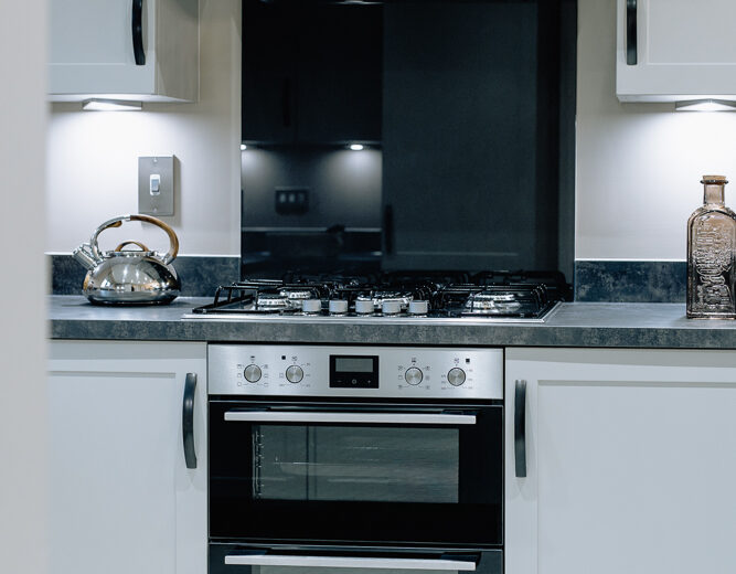 New build kitchen with built-in oven and extractor.