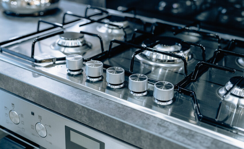 New build kitchen hob detail with stainless steel burners.
