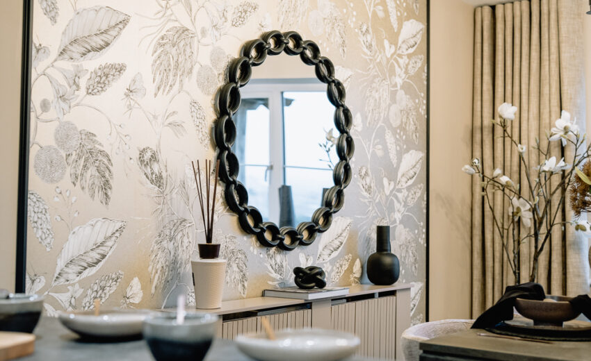 New build bathroom vanity with round mirror.