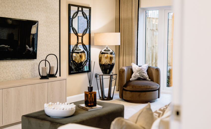 A cosy seating area with chair and decor in the Stretford new build.