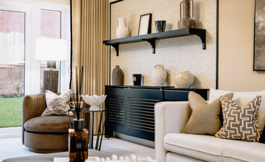New build living room with feature shelving and armchair.
