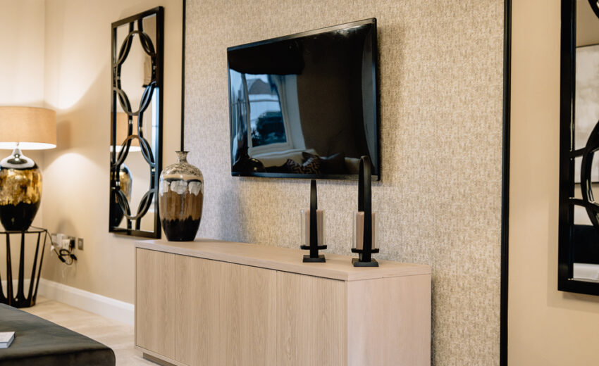 New build living room with TV unit and feature wall.