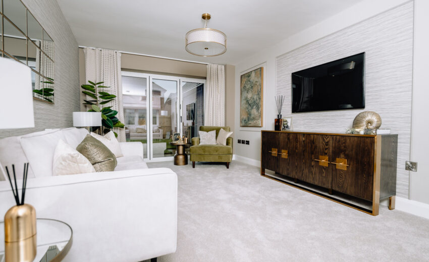 New build living room with sofa and media unit.