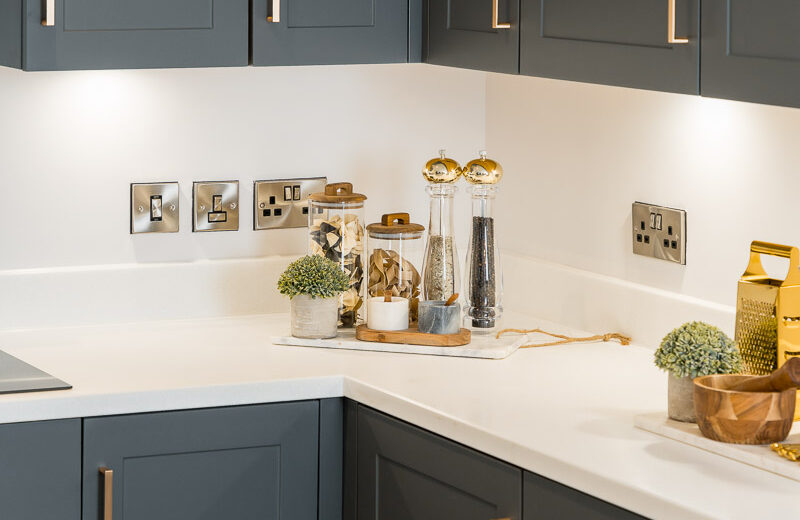 New build kitchen with dark cabinets and worktop.