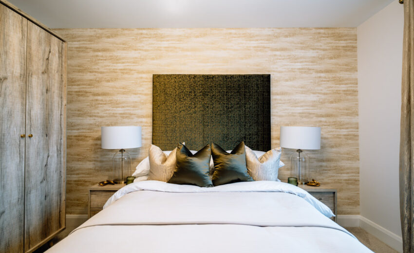 New build bedroom with upholstered headboard.